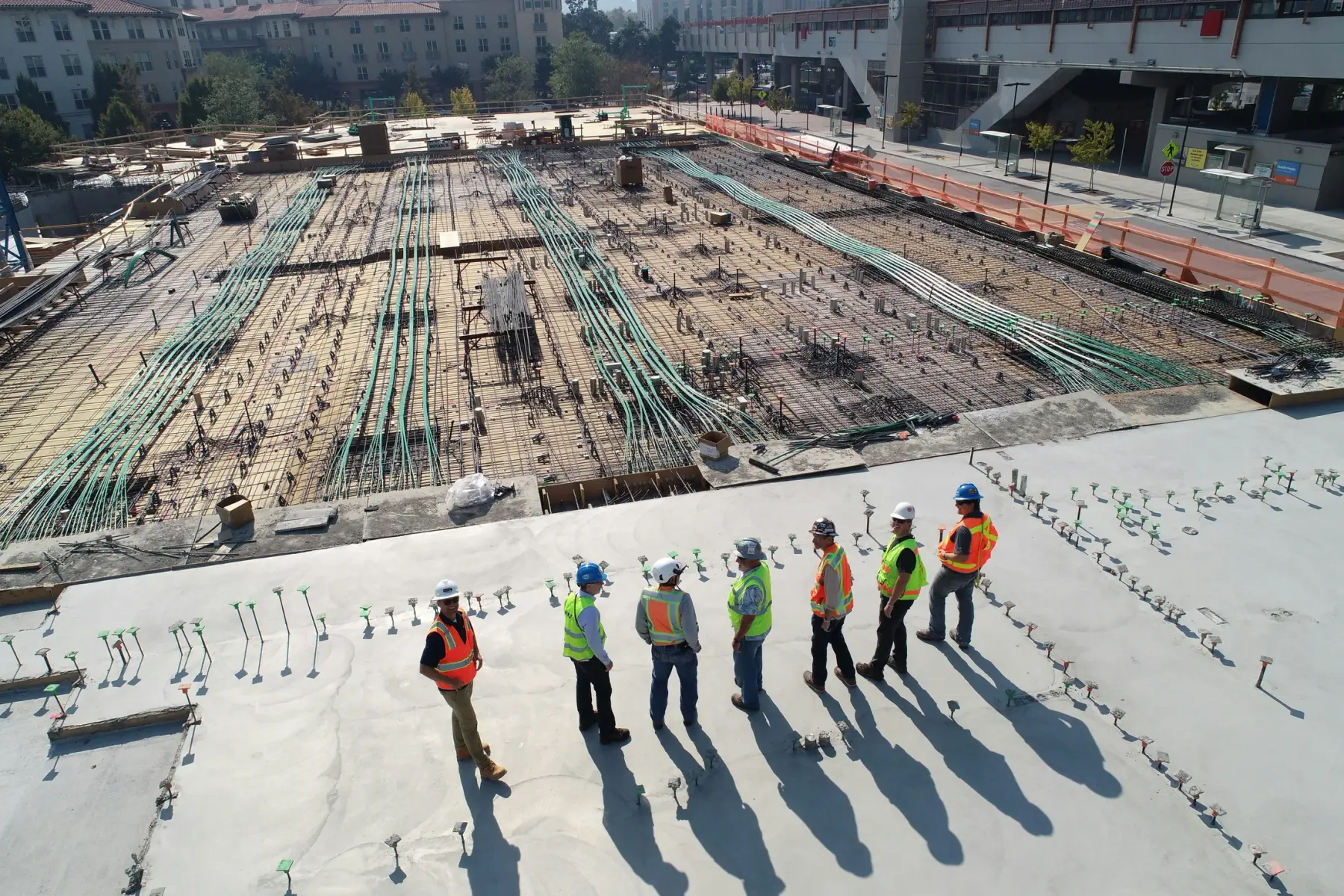 Construction supervisors walking a slab during site inspection