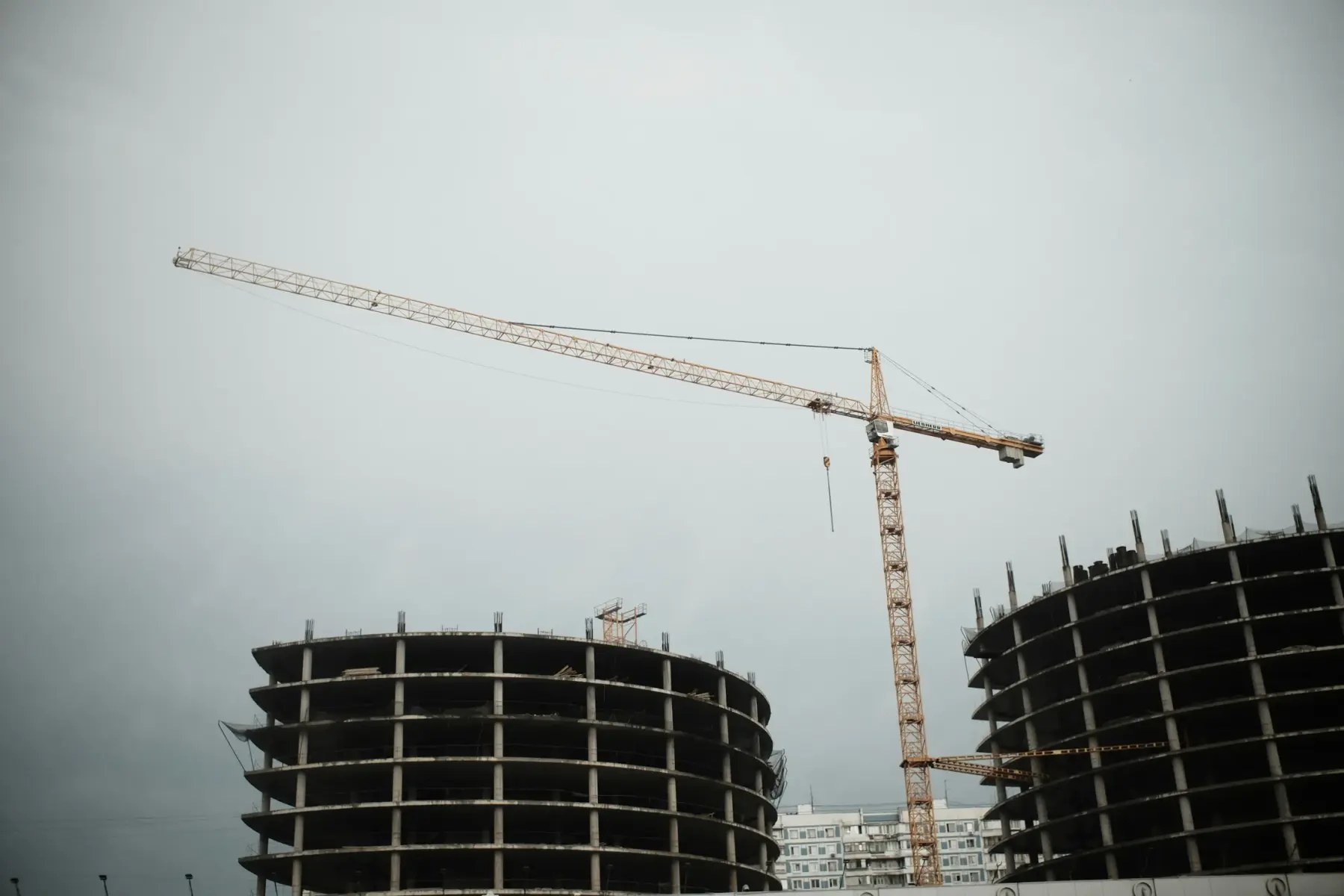 Crane lifting materials on an active construction site